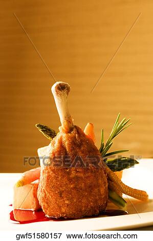 Chicken drumstick served with salad View Large Photo Image Stock Photo - Chicken drumstick served with salad. Fotosearch