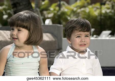 Close-up of a boy and a girl crying View Large Photo Image Stock Image - Close-up of a boy and a girl crying. Fotosearch