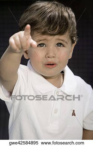 Close-up of a boy pointing View Large Photo Image Stock Photography - Close-up of a boy pointing. Fotosearch