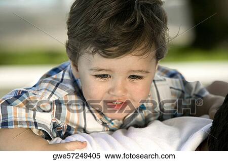 Close-up of a boy riding piggyback on his father View Large Photo Image Stock Photography - Close-up of a boy riding piggyback on his father. Fotosearch