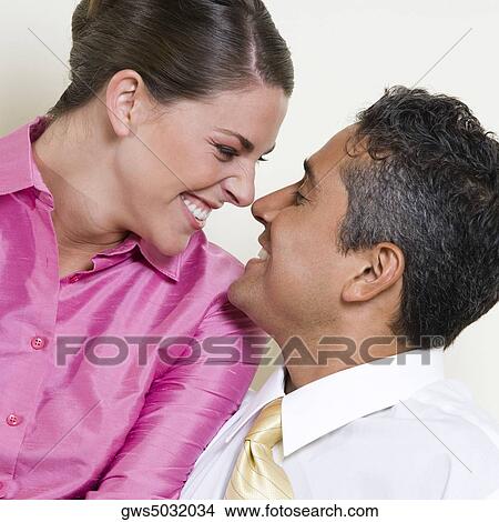 Close-up of a businessman and a businesswoman looking at each other View Large Photo Image Picture - Close-up of a businessman and a businesswoman looking at each other. Fotosearch