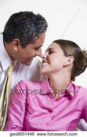 Close-up of a businessman and a businesswoman looking at each other View Large Photo Image Stock Photo - Close-up of a businessman and a businesswoman looking at each other. Fotosearch