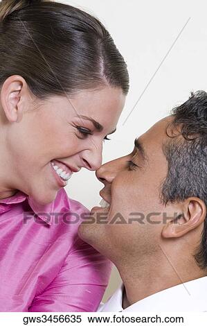 Close-up of a businessman and a businesswoman looking at each other View Large Photo Image Stock Photography - Close-up of a businessman and a businesswoman looking at each other. Fotosearch