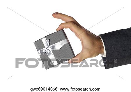 Close-up of a businessman holding a gift View Large Photo Image Stock Photograph - Close-up of a businessman holding a gift. Fotosearch