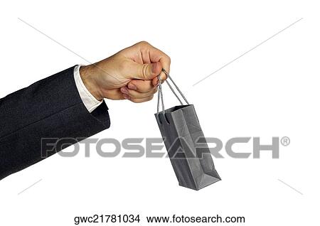 Picture - Close-up of a businessman holding a shopping bag. Fotosearch