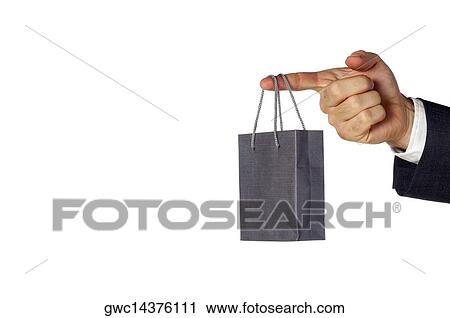Close-up of a businessman holding a shopping bag View Large Photo Image Stock Image - Close-up of a businessman holding a shopping bag. Fotosearch