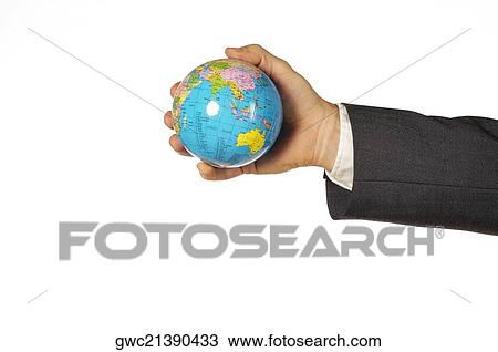 Close-up of a businessman holding a globe View Large Photo Image Stock Image - Close-up of a businessman holding a globe. Fotosearch