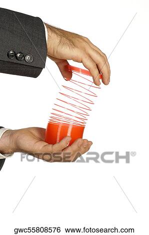 Close-up of a businessman holding a coiled spring View Large Photo Image Stock Photograph - Close-up of a businessman holding a coiled spring. Fotosearch