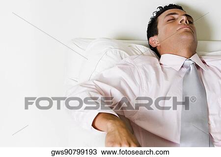 Close-up of a businessman sleeping in an armchair View Large Photo Image Stock Image - Close-up of a businessman sleeping in an armchair. Fotosearch