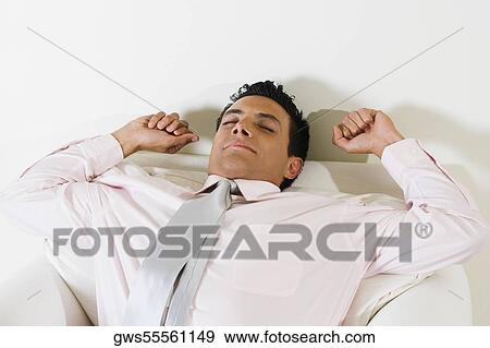 Close-up of a businessman stretching View Large Photo Image Stock Photo - Close-up of a businessman stretching. Fotosearch