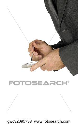 Stock Photo - Close-up of a businessman using a personal data assistant. Fotosearch
