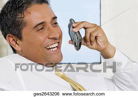 Close-up of a businessman using a mobile phone View Large Photo Image Stock Photograph - Close-up of a businessman using a mobile phone. Fotosearch