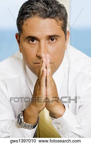 Close-up of a businessman with his hands together View Large Photo Image Stock Image - Close-up of a businessman with his hands together. Fotosearch