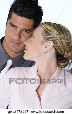 Close-up of a businesswoman looking at a businessman View Large Photo Image Stock Photo - Close-up of a businesswoman looking at a businessman. Fotosearch