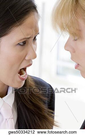 Close-up of a businesswoman scolding another businesswoman View Large Photo Image Stock Image - Close-up of a businesswoman scolding another businesswoman. Fotosearch