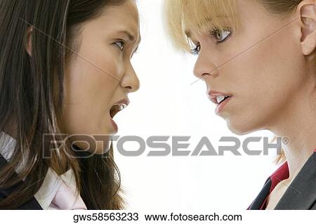 Close-up of a businesswoman scolding another businesswoman View Large Photo Image Stock Image - Close-up of a businesswoman scolding another businesswoman. Fotosearch