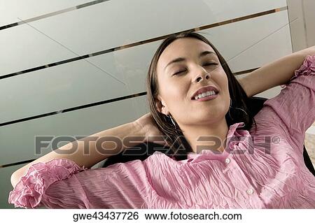 Close-up of a businesswoman smiling View Large Photo Image Stock Photograph - Close-up of a businesswoman smiling. Fotosearch