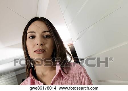 Close-up of a businesswoman standing View Large Photo Image Picture - Close-up of a businesswoman standing. Fotosearch