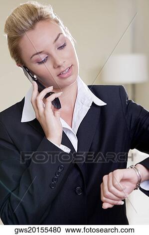 Close-up of a businesswoman talking on a mobile phone View Large Photo Image Stock Image - Close-up of a businesswoman talking on a mobile phone. Fotosearch