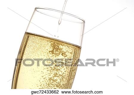 Close-up of a champagne poured into a champagne flute View Large Photo Image Stock Image - Close-up of a champagne poured into a champagne flute. Fotosearch