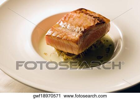 Stock Image - Close-up of a dish of filleted fish. Fotosearch