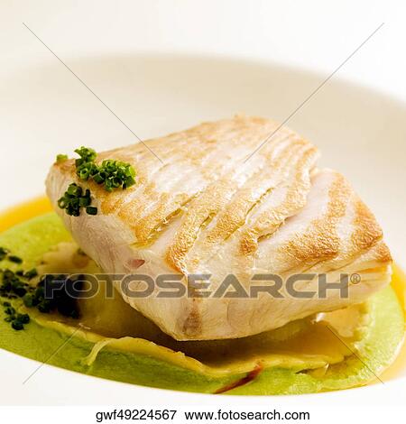 Stock Photo - Close-up of a dish of filleted fish. Fotosearch