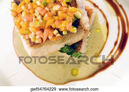 Stock Photo - Close-up of a dish of filleted fish. Fotosearch