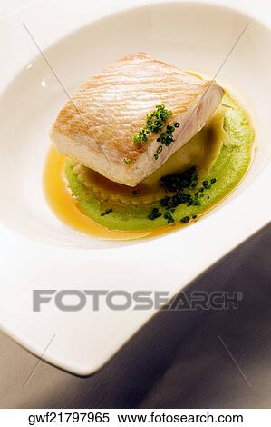 Close-up of a dish of filleted fish View Large Photo Image Stock Photography - Close-up of a dish of filleted fish. Fotosearch
