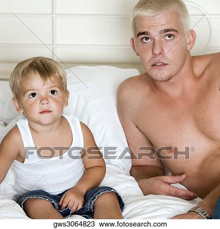 Close-up of a father and his son looking up View Large Photo Image Stock Image - Close-up of a father and his son looking up. Fotosearch