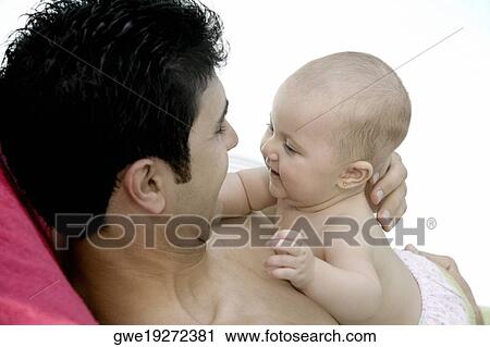 Close-up of a father with his daughter View Large Photo Image Stock Image - Close-up of a father with his daughter. Fotosearch