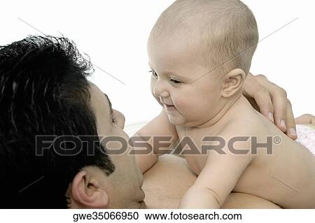 Stock Image - Close-up of a father with his daughter. Fotosearch