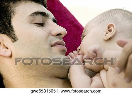 Close-up of a father with his daughter View Large Photo Image Stock Image - Close-up of a father with his daughter. Fotosearch