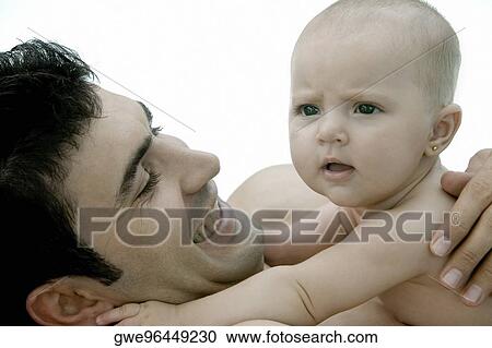 Close-up of a father with his daughter View Large Photo Image Stock Image - Close-up of a father with his daughter. Fotosearch