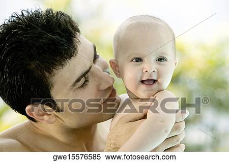 Close-up of a father with his daughter View Large Photo Image Stock Photography - Close-up of a father with his daughter. Fotosearch