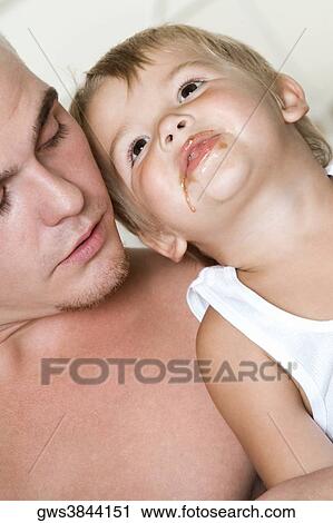 Close-up of a father with his son View Large Photo Image Stock Image - Close-up of a father with his son. Fotosearch