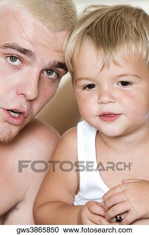 Close-up of a father with his son View Large Photo Image Stock Image - Close-up of a father with his son. Fotosearch