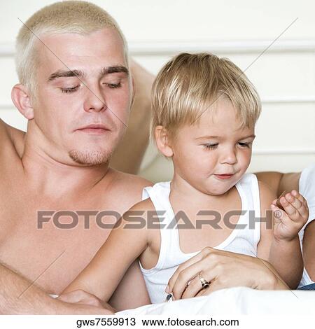 Close-up of a father with his son View Large Photo Image Stock Image - Close-up of a father with his son. Fotosearch