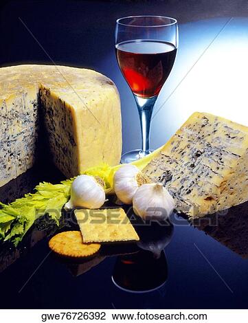 Close-up of a glass of red wine and slice of cheese View Large Photo Image Stock Image - Close-up of a glass of red wine and slice of cheese. Fotosearch