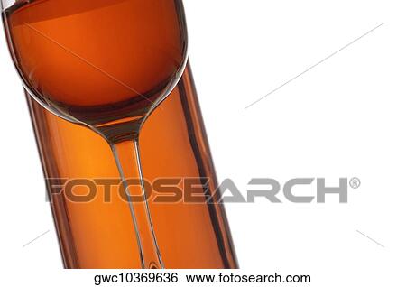 Close-up of a glass of wine with a wine bottle View Large Photo Image Stock Photograph - Close-up of a glass of wine with a wine bottle. Fotosearch