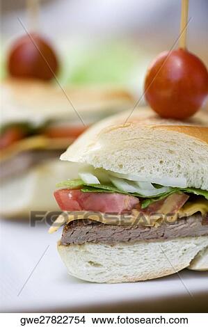 Picture - Close-up of a hamburger in a plate. Fotosearch