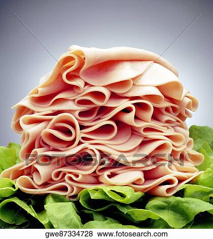 Close-up of a heap of ham on lettuce leaves View Large Photo Image Stock Photo - Close-up of a heap of ham on lettuce leaves. Fotosearch