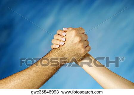 Close-up of a man and a woman arm wrestling View Large Photo Image Stock Image - Close-up of a man and a woman arm wrestling. Fotosearch