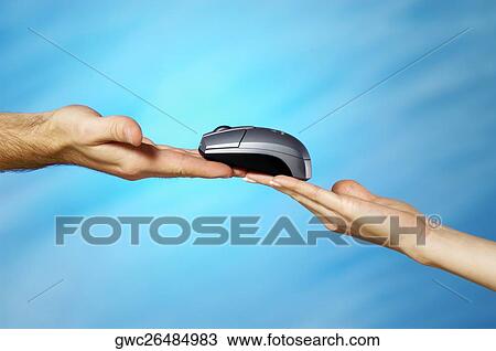 Stock Image - Close-up of a man and a woman's hands holding a computer mouse. Fotosearch