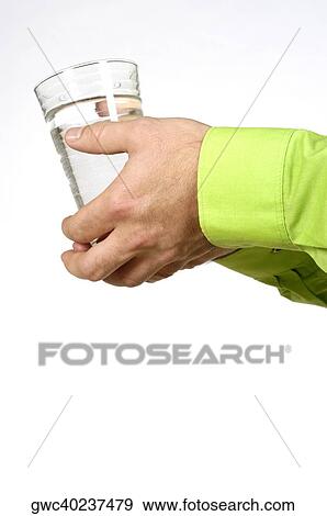 Close-up of a man's hands holding a glass of water View Large Photo Image Stock Photo - Close-up of a man's hands holding a glass of water. Fotosearch