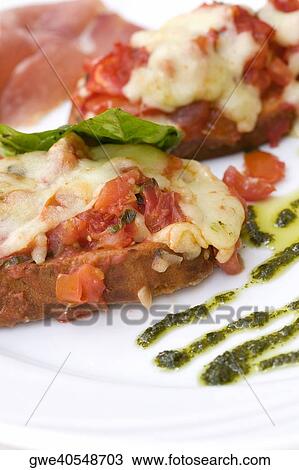 Close-up of a meat dish in a plate View Large Photo Image Stock Image - Close-up of a meat dish in a plate. Fotosearch