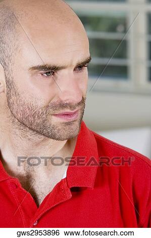 Close-up of a mid adult man looking sad View Large Photo Image Stock Photograph - Close-up of a mid adult man looking sad. Fotosearch