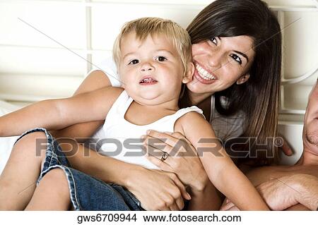 Close-up of a mother and her son View Large Photo Image Picture - Close-up of a mother and her son. Fotosearch