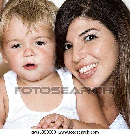 Close-up of a mother and her son View Large Photo Image Stock Photo - Close-up of a mother and her son. Fotosearch
