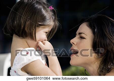 Close-up of a mother with her daughter View Large Photo Image Picture - Close-up of a mother with her daughter. Fotosearch
