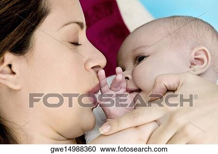 Close-up of a mother with her daughter View Large Photo Image Stock Image - Close-up of a mother with her daughter. Fotosearch